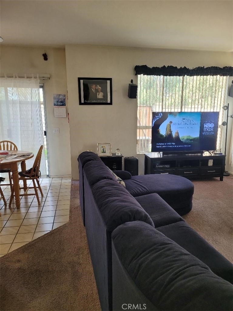 866 Homestead Road Corona, CA 92878 - Photo 3 of 15 a living room with furniture and a flat screen tv