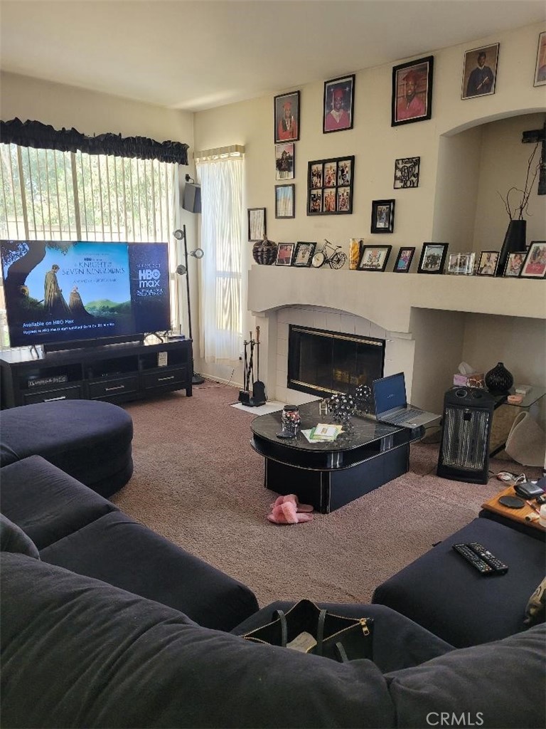 866 Homestead Road Corona, CA 92878 - Photo 4 of 15 a living room with furniture and a fireplace