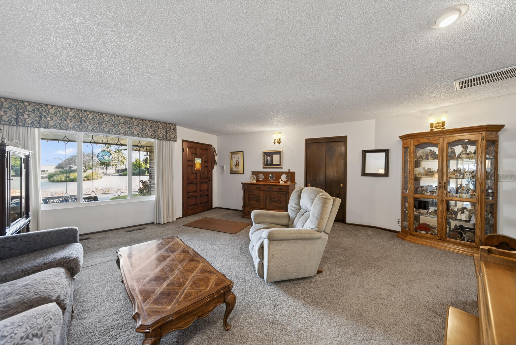 3605 Tamarack Drive Redding, CA 96003 - Photo 13 of 49 a living room with furniture and a large window