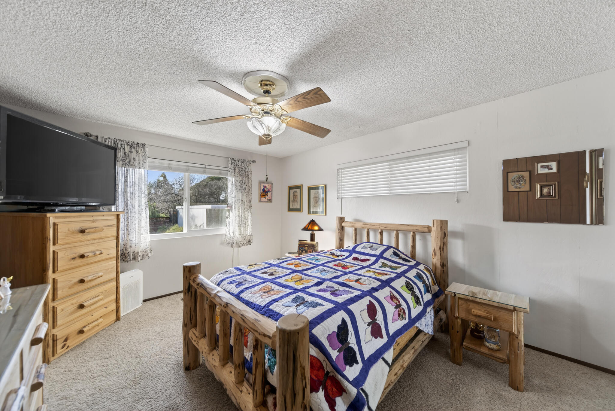 3605 Tamarack Drive Redding, CA 96003 - Photo 22 of 49 a bedroom with a bed and a flat screen tv