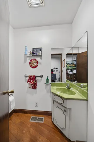a bathroom with a tub and washer