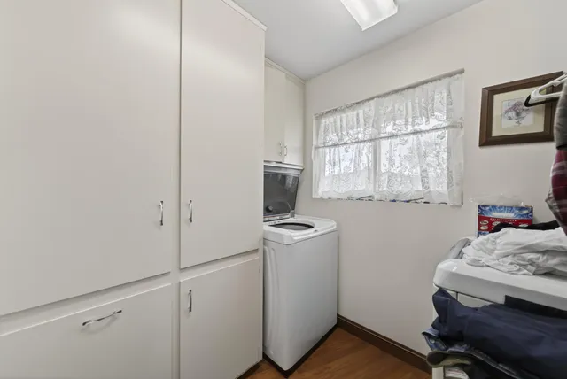 a room with a bed and a window