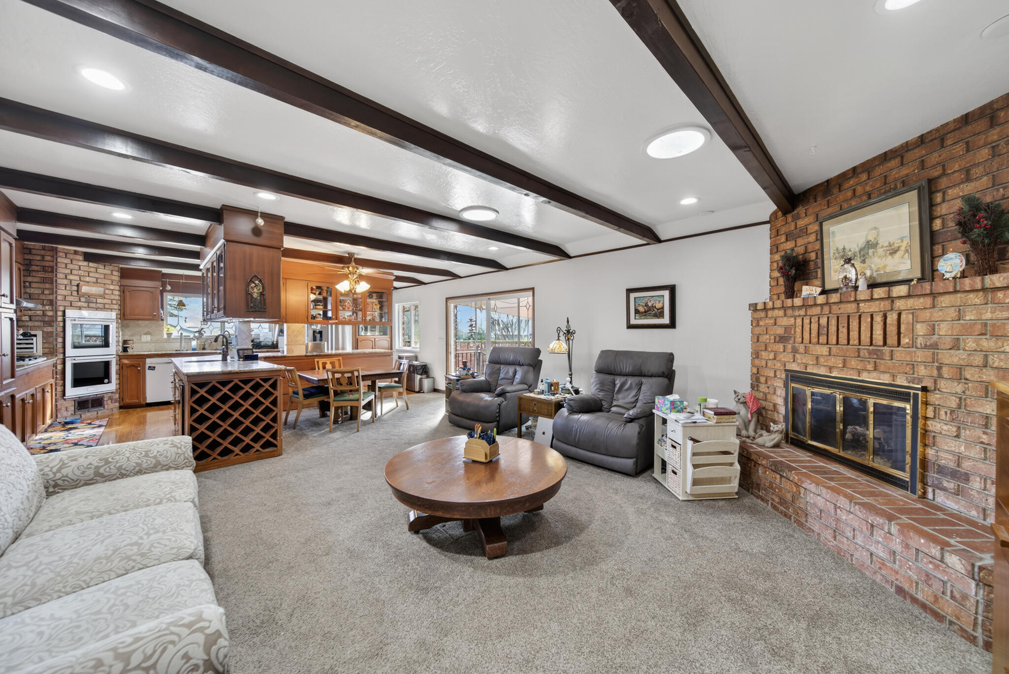 3605 Tamarack Drive Redding, CA 96003 - Photo 3 of 49 a living room with furniture and a fireplace