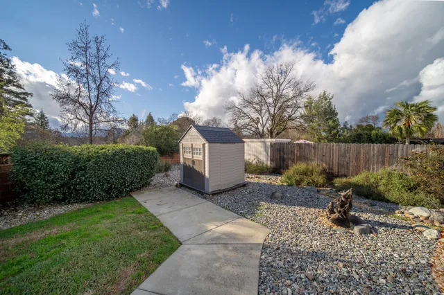 a backyard of a house with lots of green space