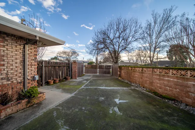 a view of a backyard of the house