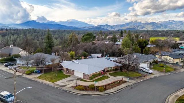 an aerial view of houses with outdoor space