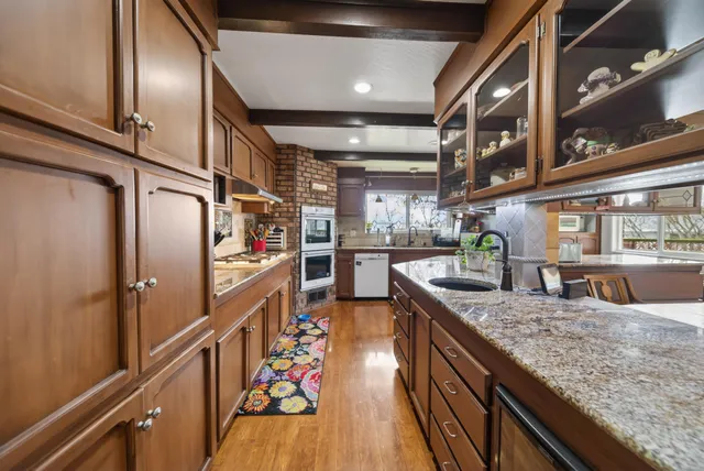 a kitchen with stainless steel appliances granite countertop lots of counter top space