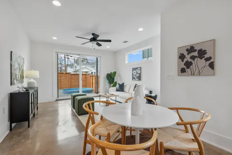 a dining room with furniture and window