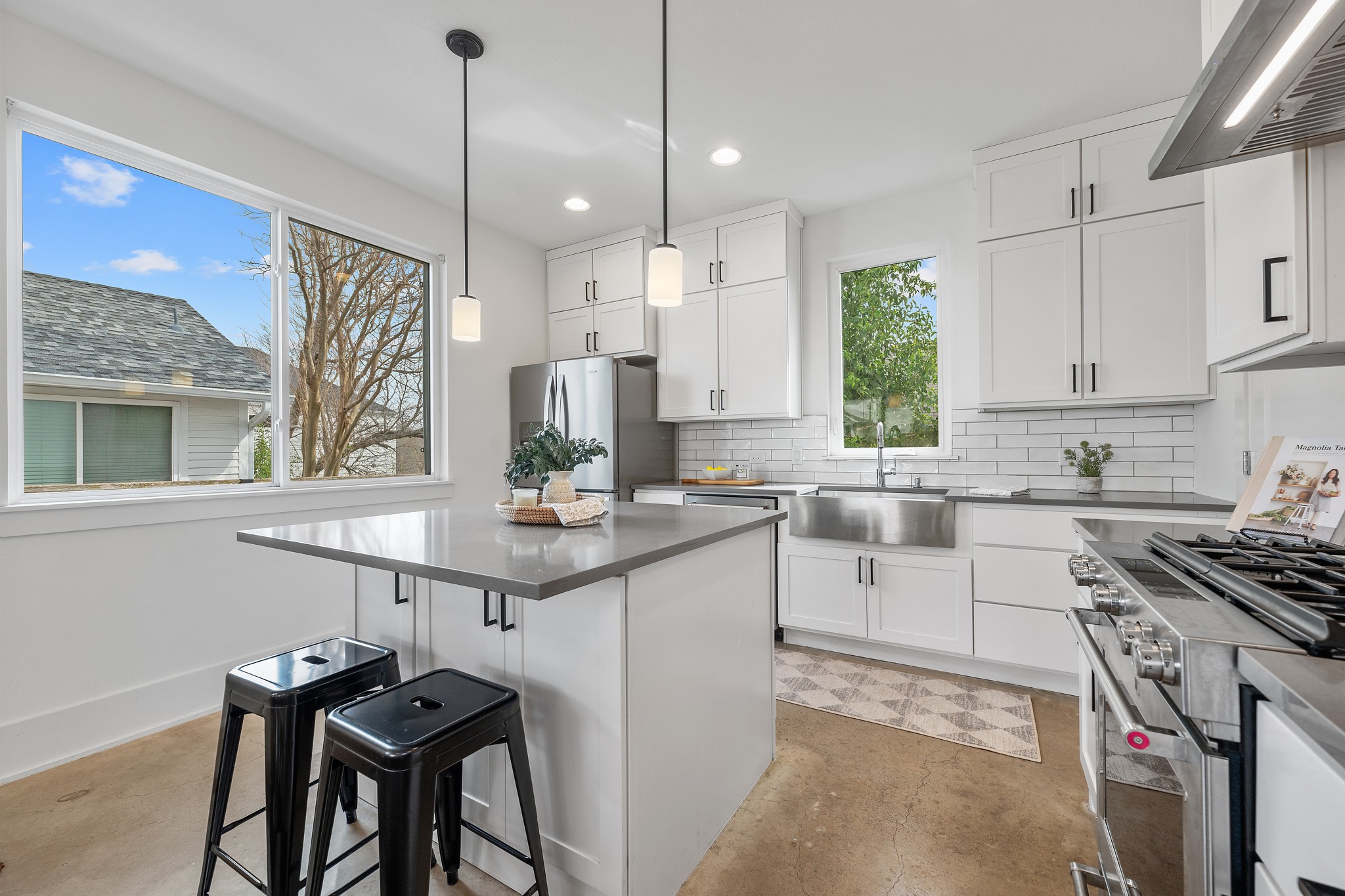 5000 Baker Street Austin, TX 78721 - Photo 16 of 40 A center island with breakfast bar seating provides a casual place for morning coffee, quick meals, or keeping the cook company