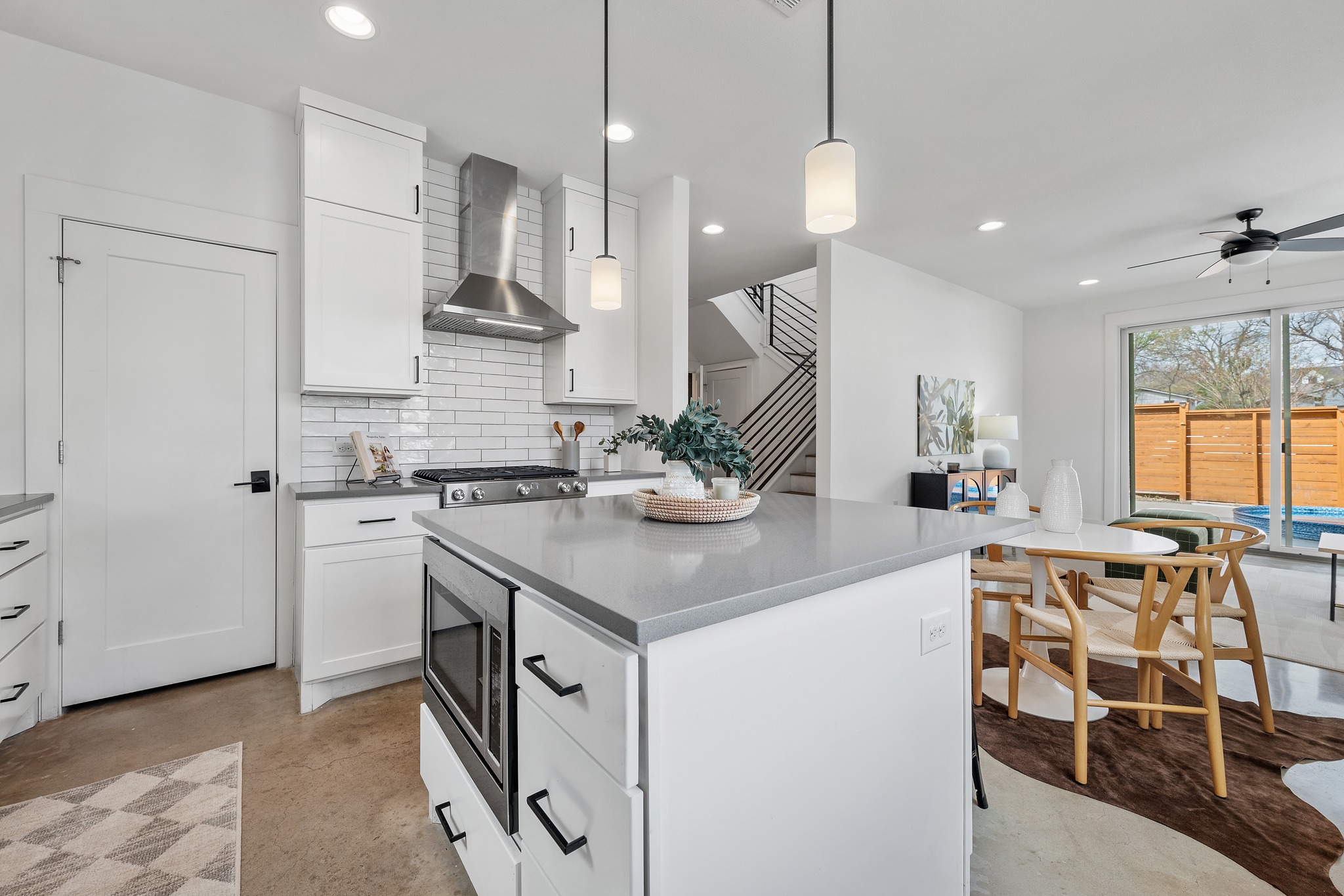 5000 Baker Street Austin, TX 78721 - Photo 18 of 40 Stainless appliances and decorative tile accents complete the kitchen, bringing together thoughtful finishes with plenty of storage for everyday use
