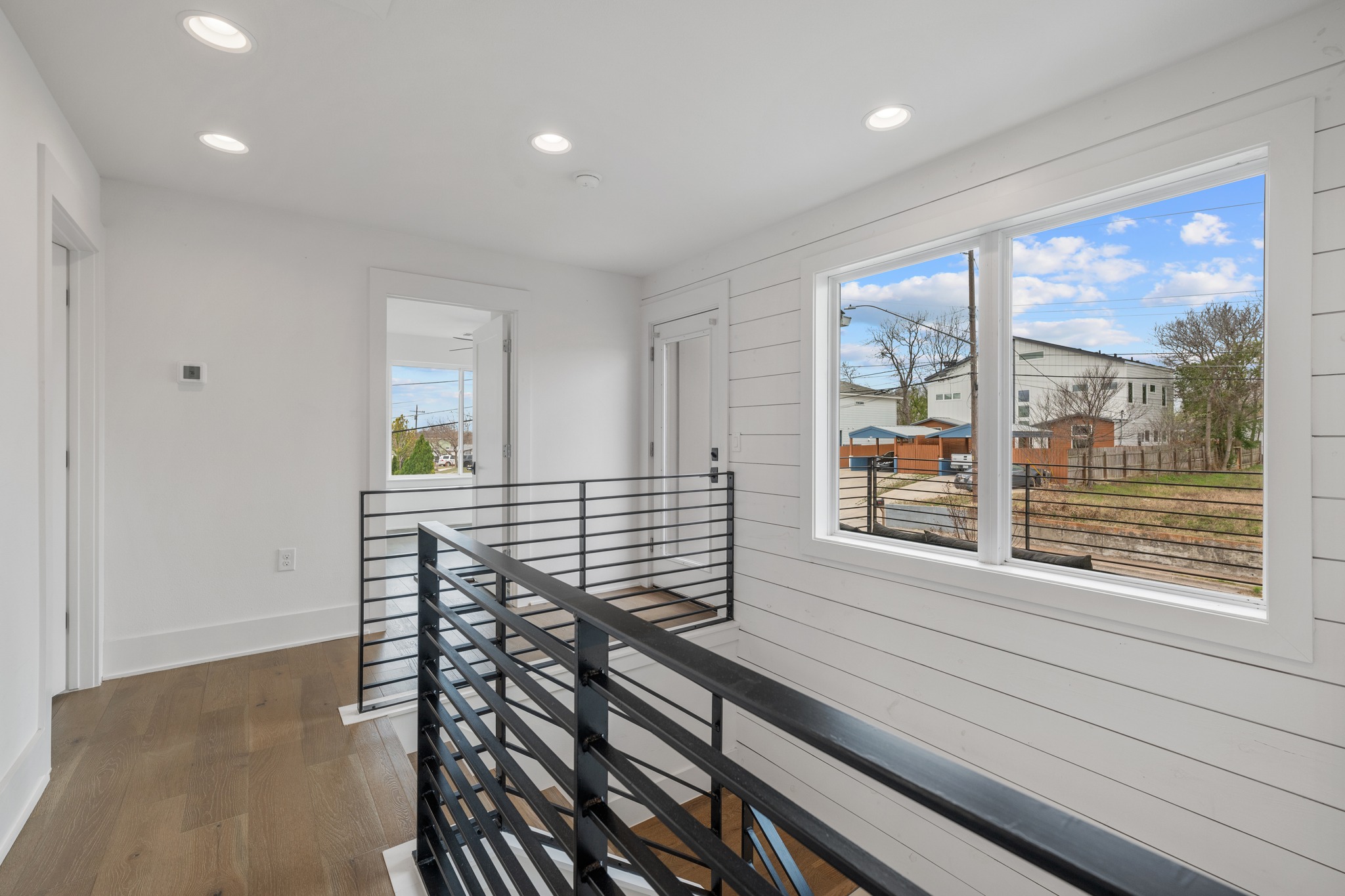 5000 Baker Street Austin, TX 78721 - Photo 23 of 40 The landing walls offer a natural place to add artwork, framed photos, or shelving, turning the space into a personalized gallery as you move between the upstairs rooms