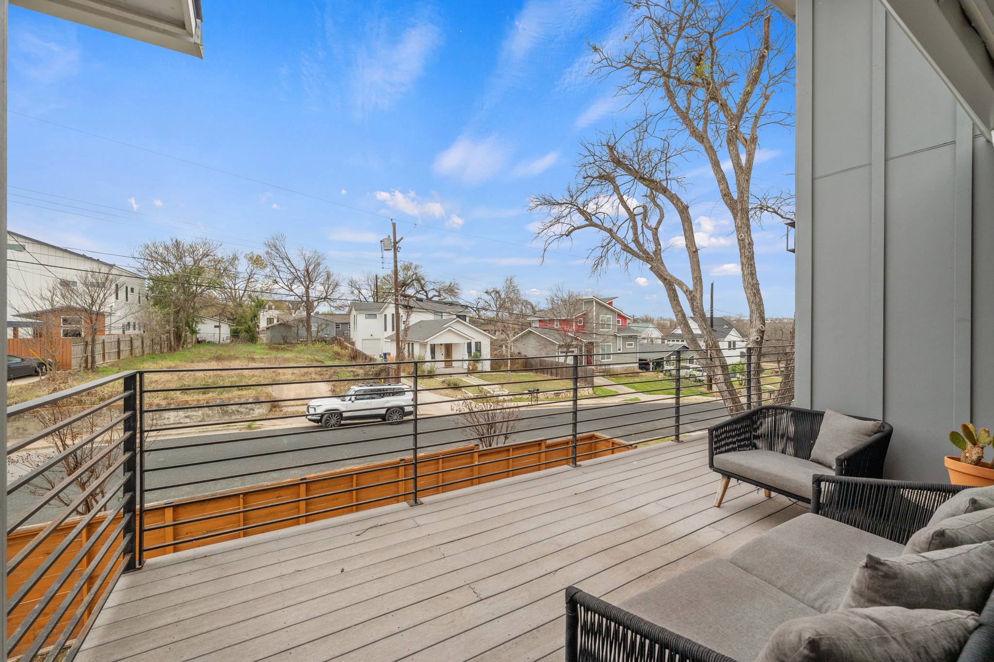 5000 Baker Street Austin, TX 78721 - Photo 25 of 40 The large second-floor balcony provides an inviting outdoor space for morning coffee, casual conversations, or evening gatherings