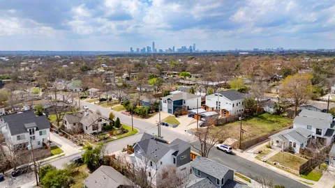 an aerial view of a city with lots of residential buildings