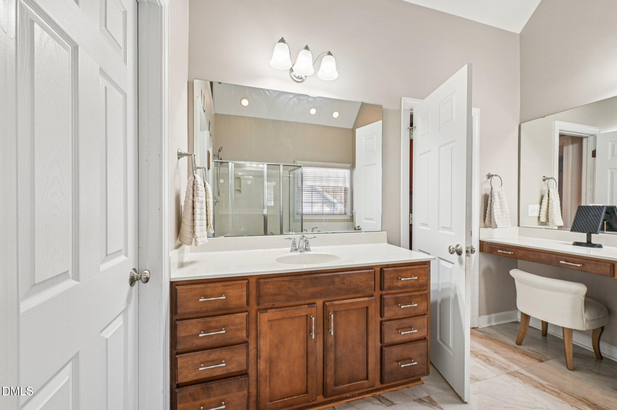7 Brightfield Lane Durham, NC 27712 - Photo 19 of 41 a bathroom with a granite countertop sink and a mirror