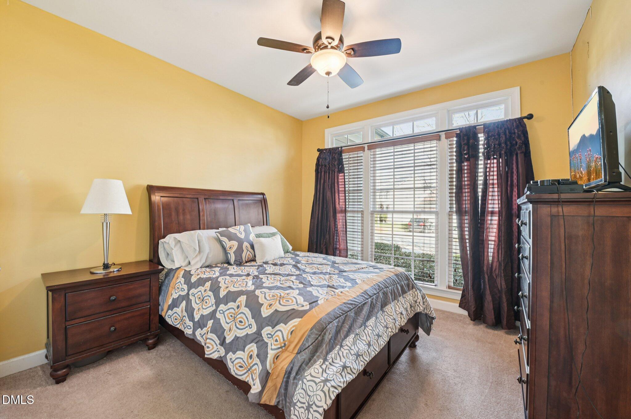 7 Brightfield Lane Durham, NC 27712 - Photo 21 of 41 a bedroom with a bed dresser and a window