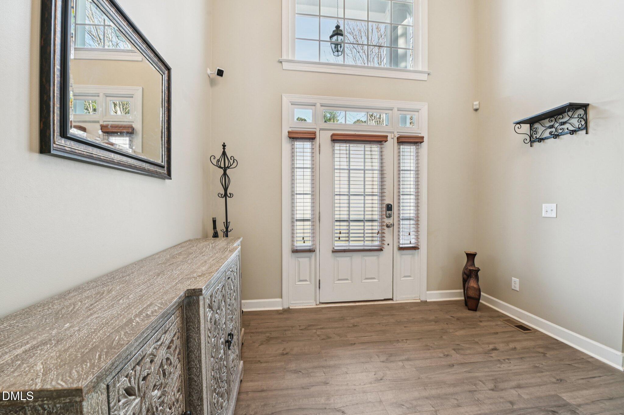 7 Brightfield Lane Durham, NC 27712 - Photo 3 of 41 a view of livingroom with hallway and wooden floor