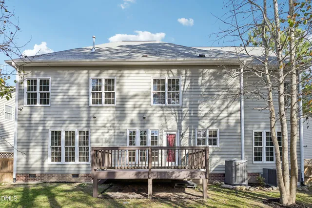 a view of a balcony with two chairs and a table