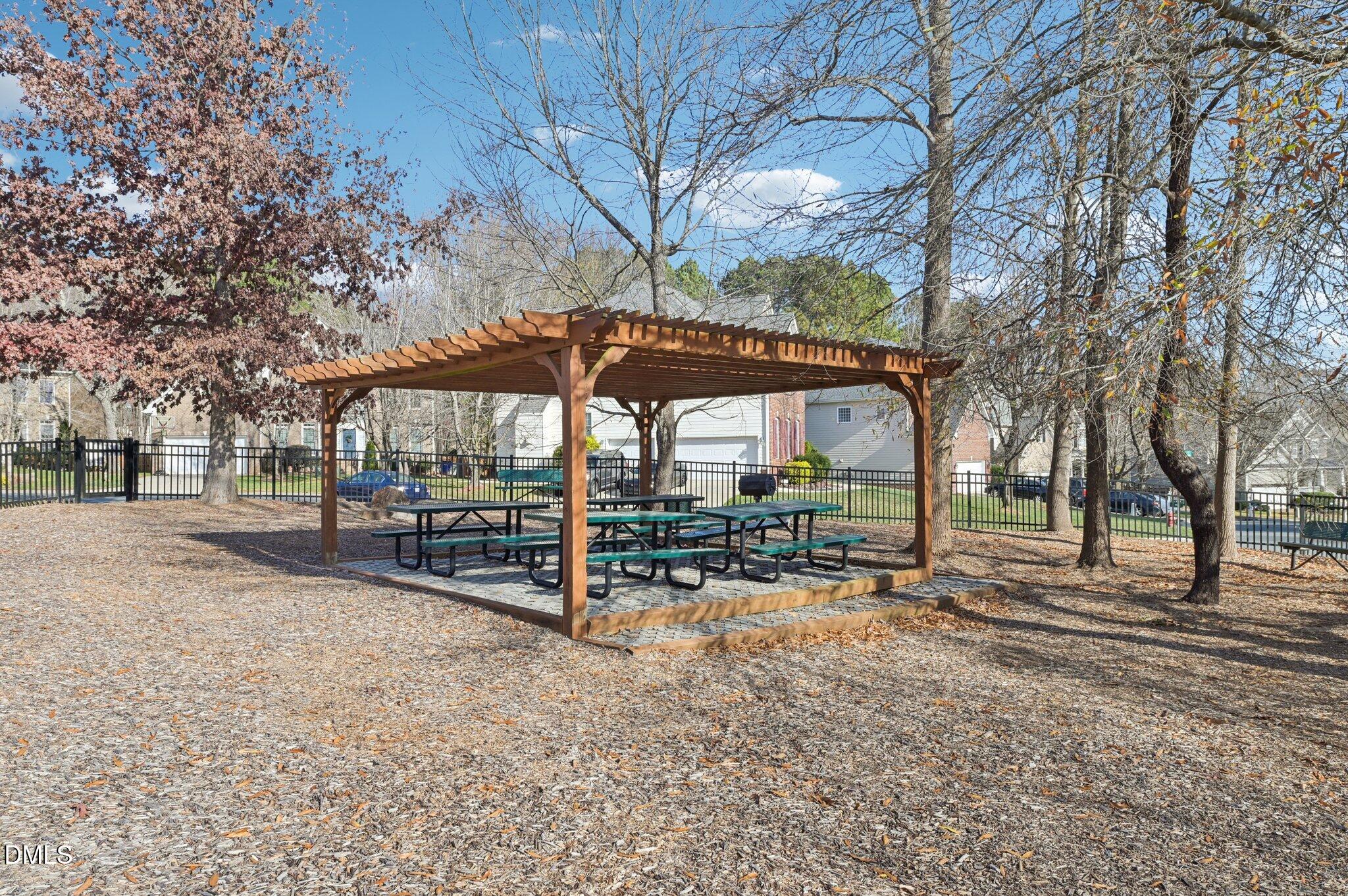 7 Brightfield Lane Durham, NC 27712 - Photo 38 of 41 a view of patio with chairs and table under an umbrella