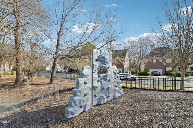 a view of a yard with large trees
