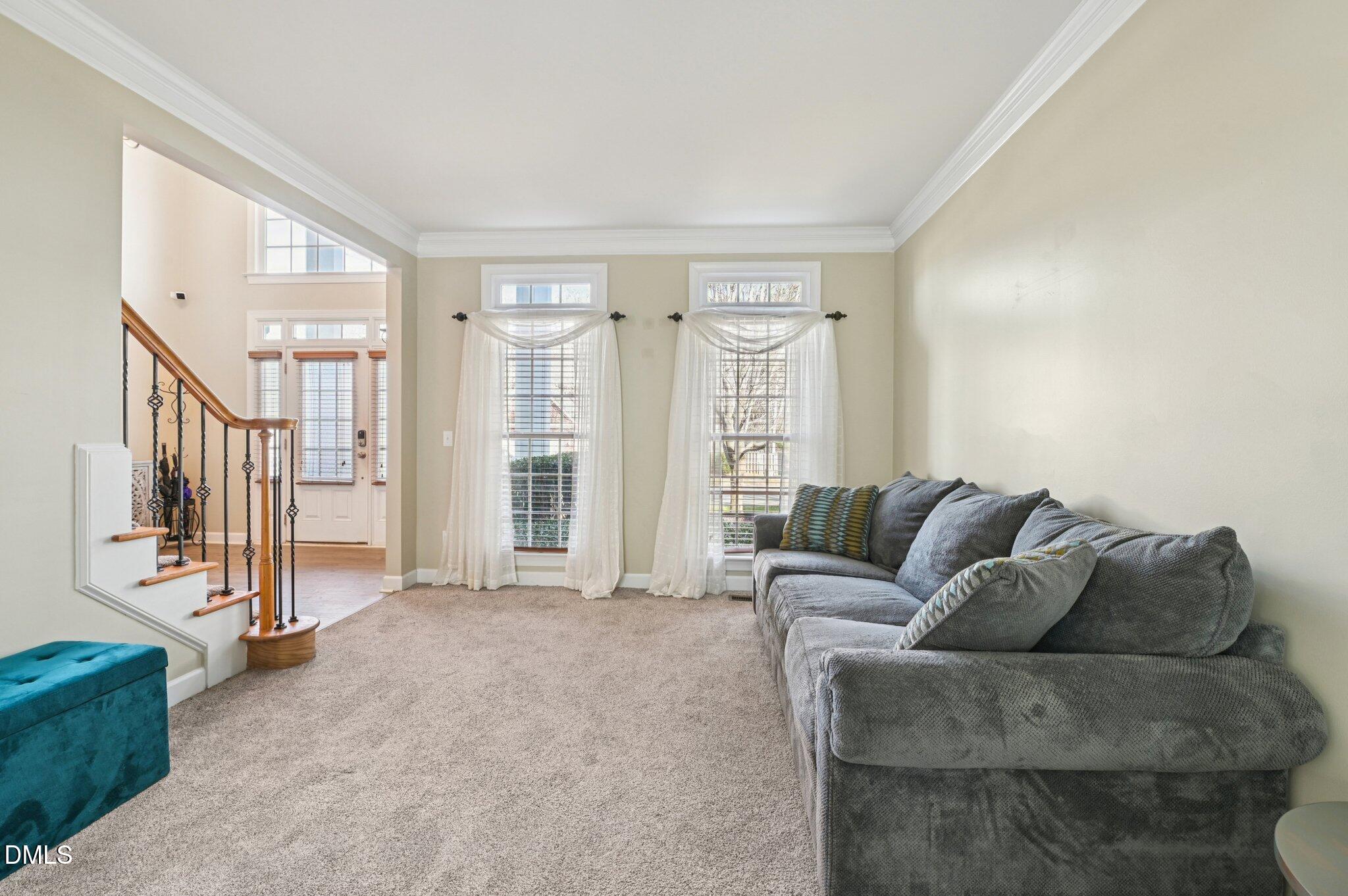 7 Brightfield Lane Durham, NC 27712 - Photo 6 of 41 a living room with furniture and a flat screen tv