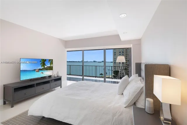 a bathroom with a sink toilet a mirror and shower