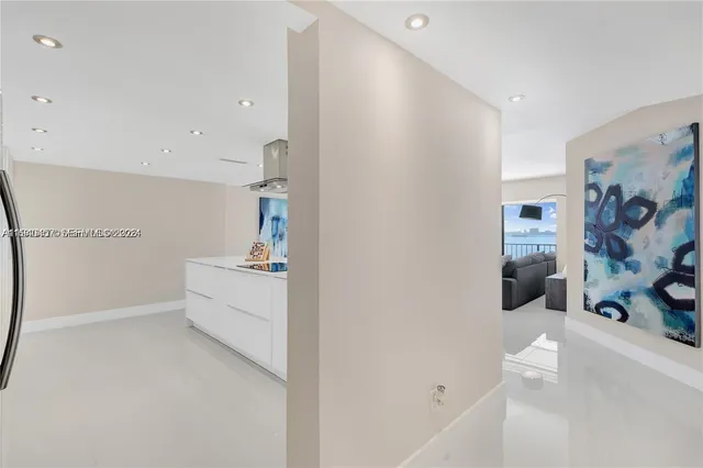 a bedroom with furniture and a flat screen tv