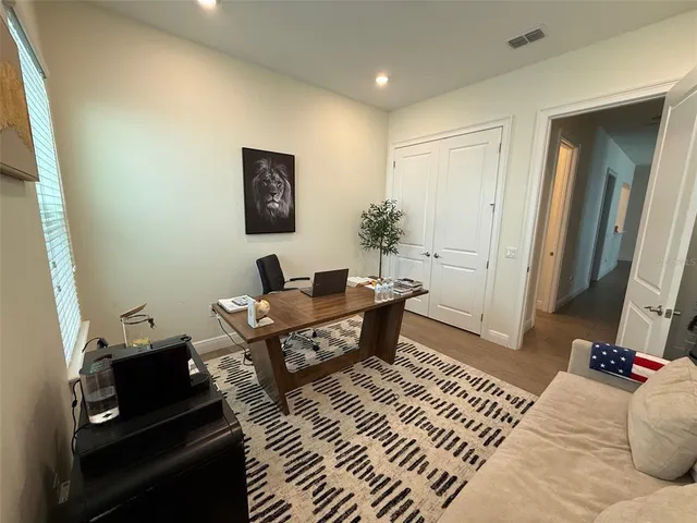 a bathroom with a sink toilet double vanity and shower