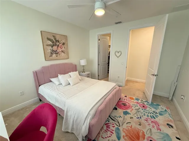 a bathroom with a granite countertop sink a toilet and a shower
