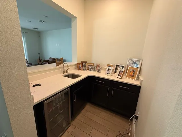 a spacious bedroom with a bed and wooden floor