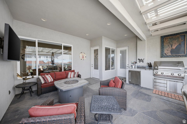 2829 East 1880th Street South St. George, UT 84790 - Photo 33 of 54 View of patio / terrace with an outdoor fire pit and an outdoor kitchen with living area