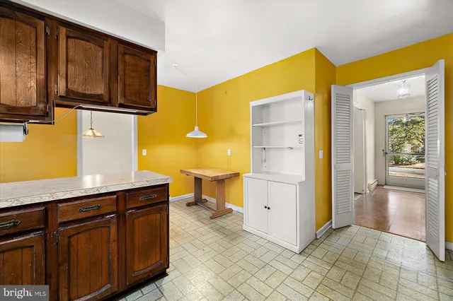 a kitchen with a sink cabinets and appliances