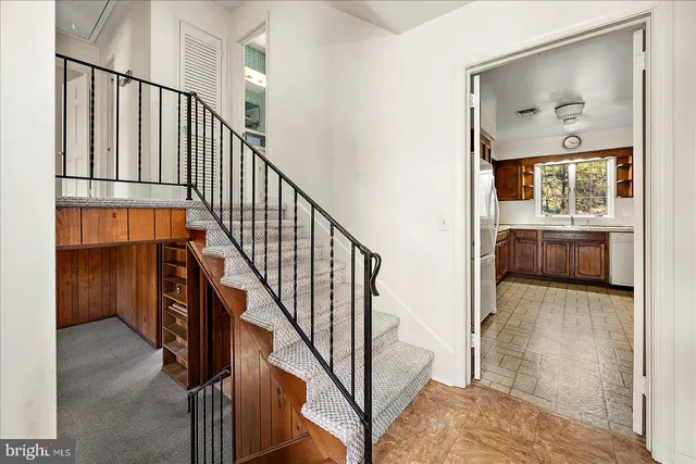 a view of staircase with wooden floor and staircase