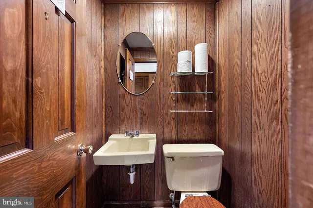 a view of a room with wooden floor and a window
