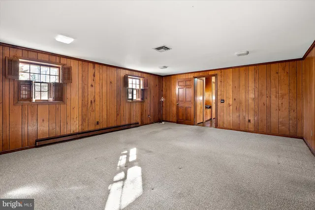 a kitchen with stainless steel appliances granite countertop a refrigerator a sink and a stove