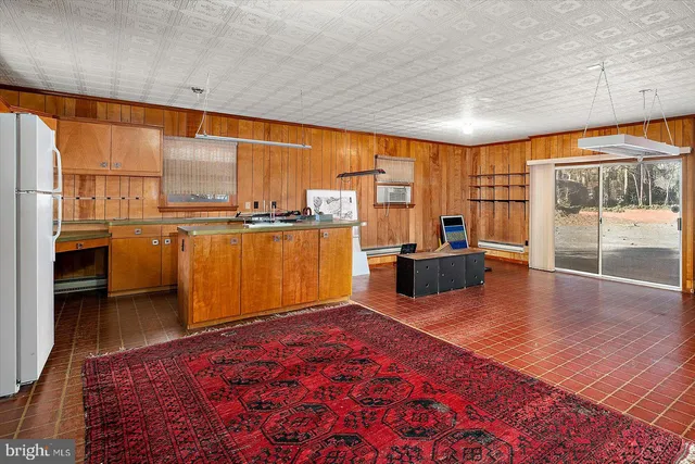 a view of a hallway with seating area