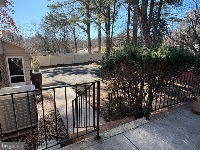 a view of a white house with a snow in front of it