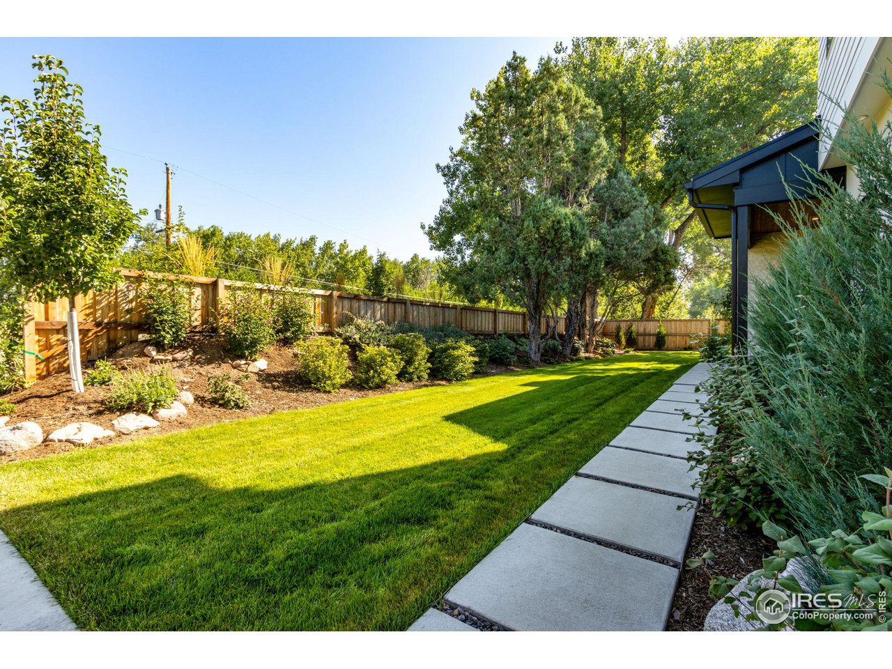 1660 Violet Avenue Boulder, CO 80304 - Photo 36 of 40 a view of yard with swimming pool and green space