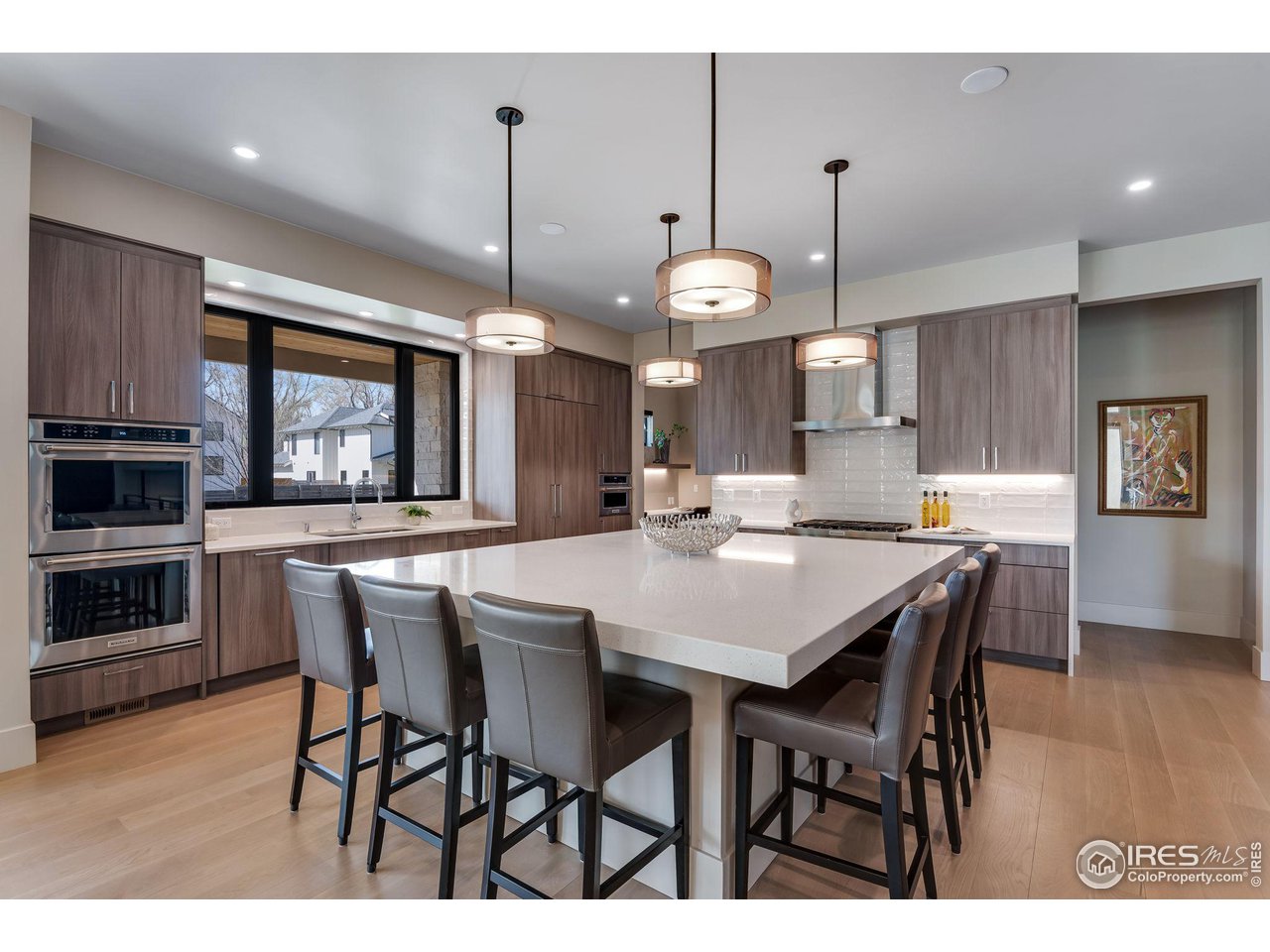 1660 Violet Avenue Boulder, CO 80304 - Photo 5 of 40 a large kitchen with a table and chairs
