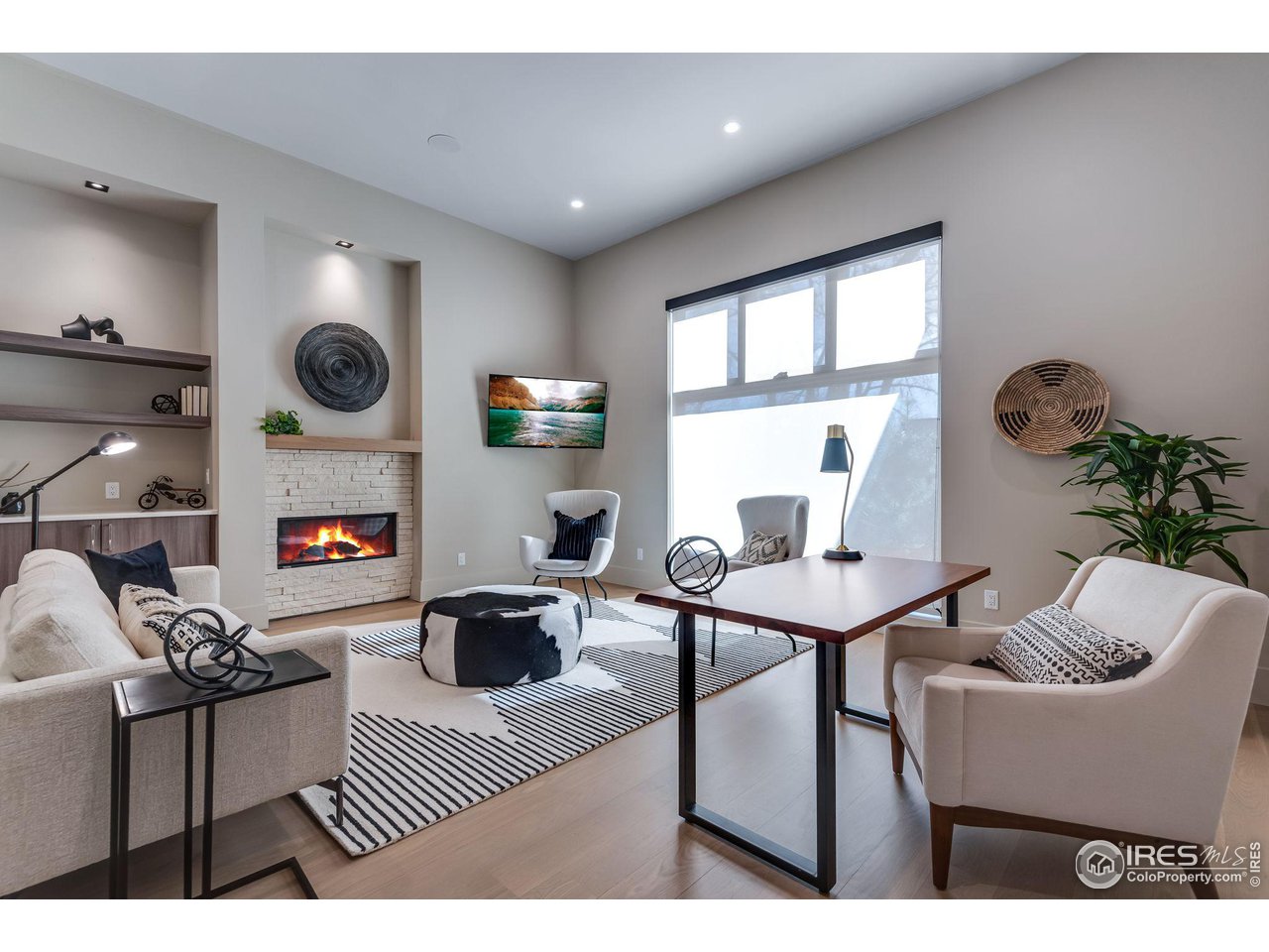 1660 Violet Avenue Boulder, CO 80304 - Photo 9 of 40 a living room with furniture a table and a fireplace