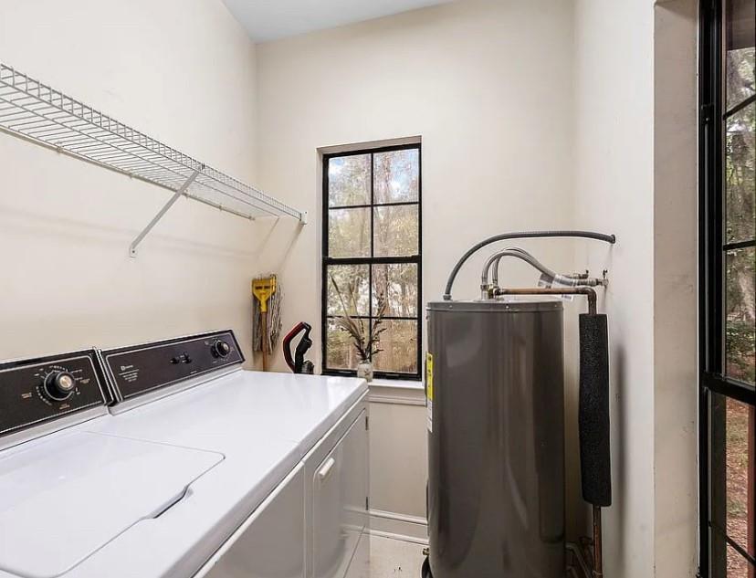 1525 Black Island Road Darien, GA 31305 - Photo 25 of 41 a kitchen with a refrigerator a stove a sink and a window