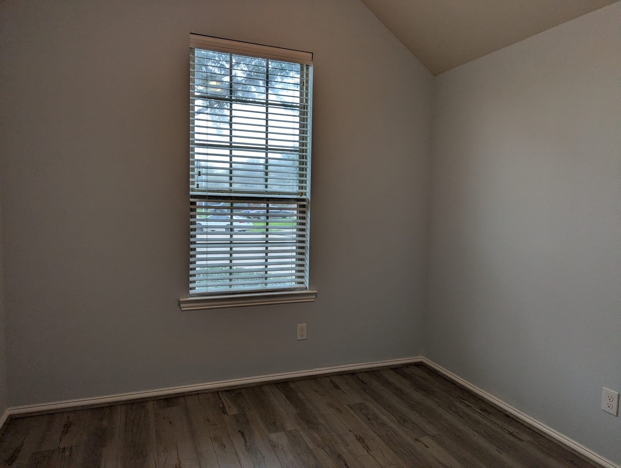8041 Silent Deep Drive Rosenberg, TX 77469 - Photo 20 of 24 Serene third bedroom featuring natural light and modern flooring.