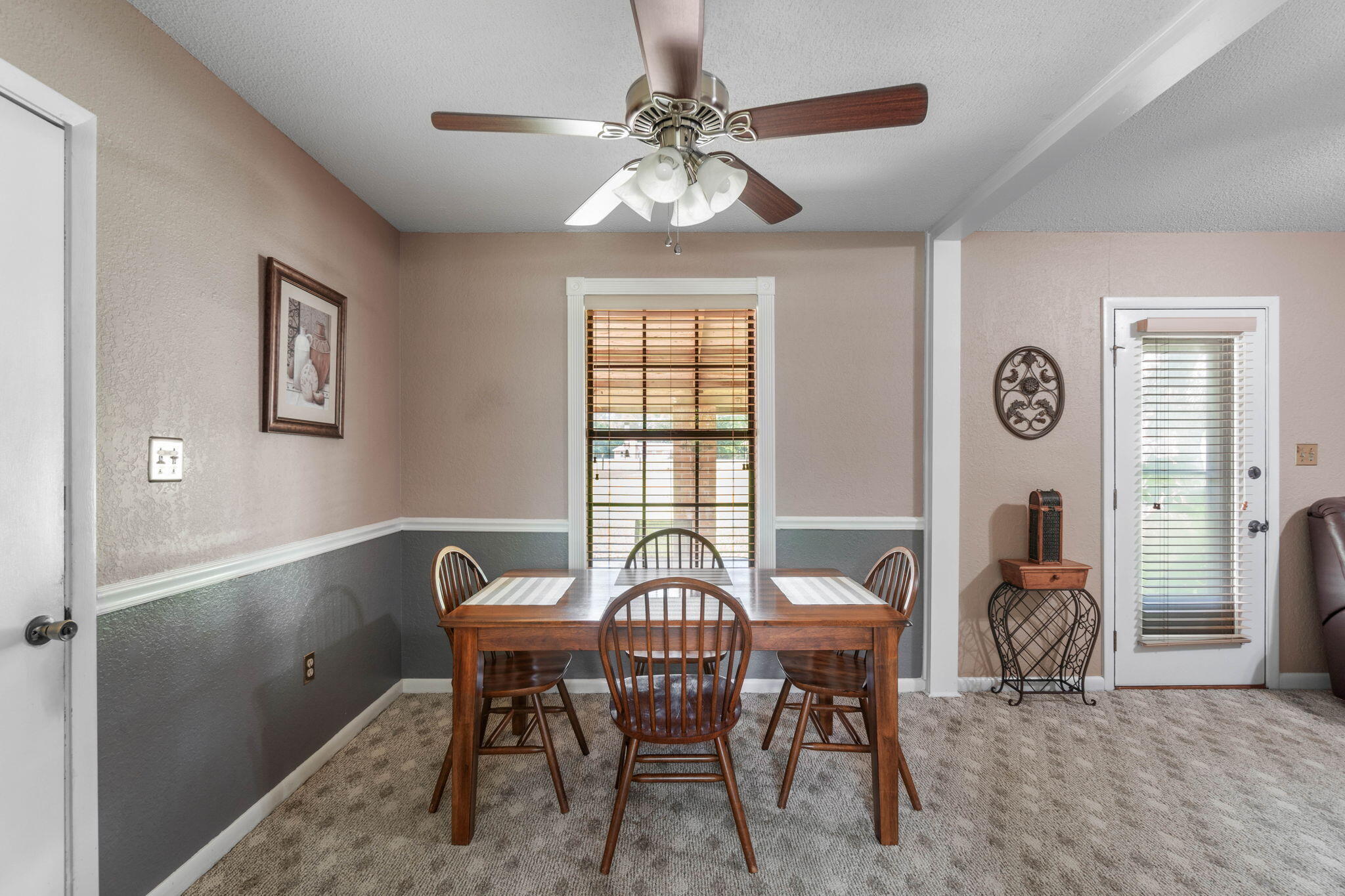 3451 Auburn Road Crestview, FL 32539 - Photo 8 of 36 a view of a dining room with furniture and chandelier