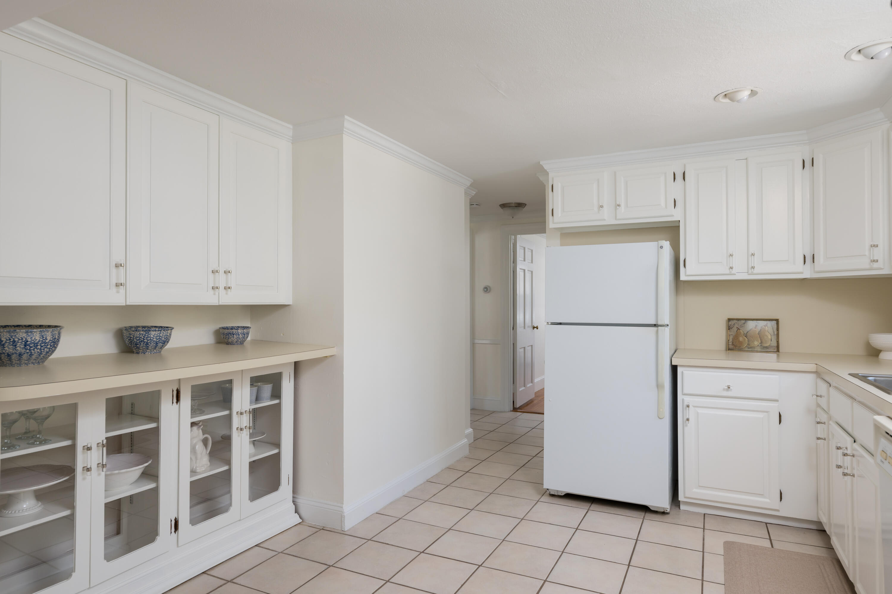 111 Lewis Road West Yarmouth, MA 02673 - Photo 15 of 43 a kitchen with cabinets and white appliances