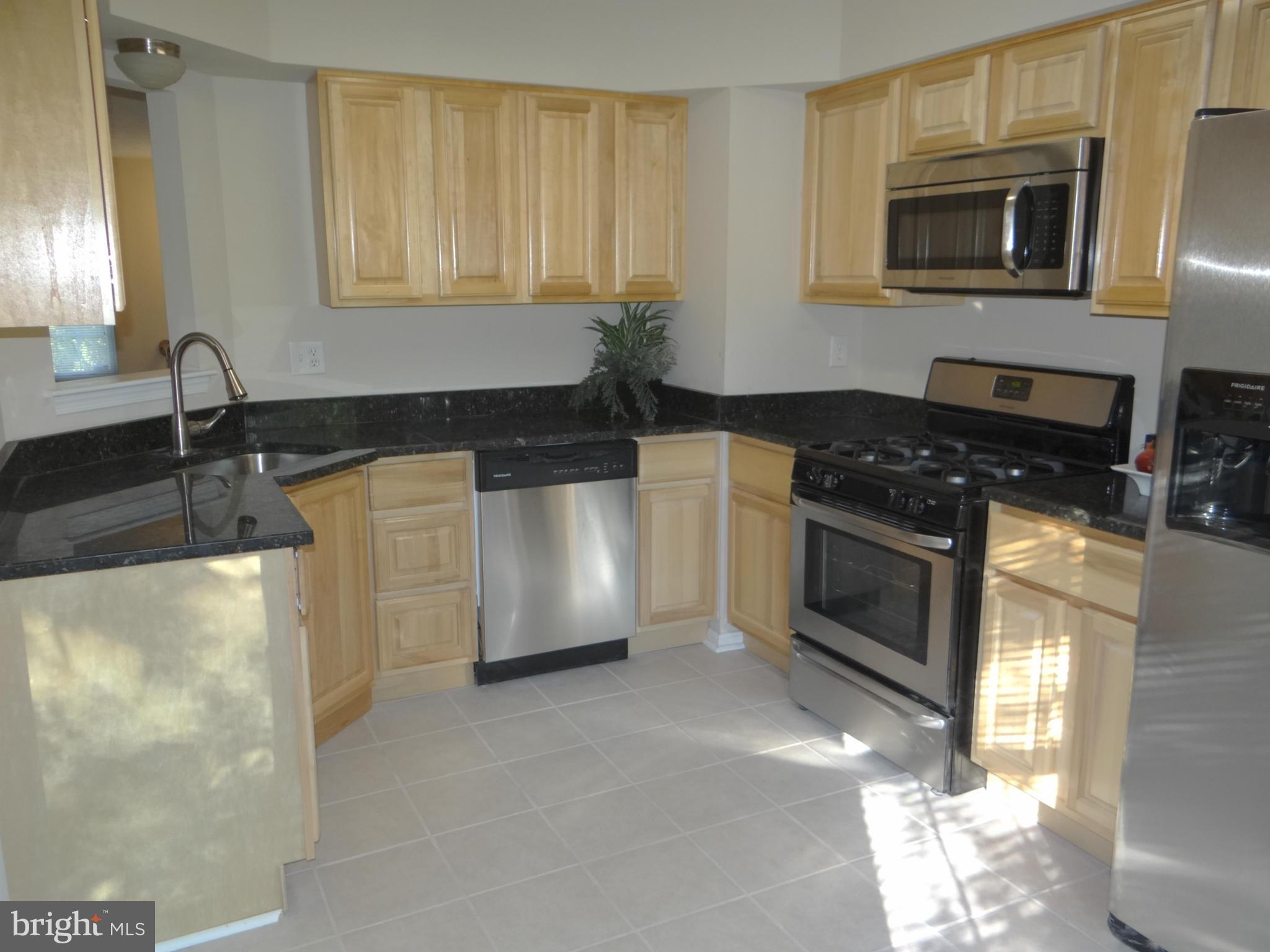 202 Windy Ridge Court Pasadena, MD 21122 - Photo 2 of 28 New Kitchen with Granite and Stainless Appliances