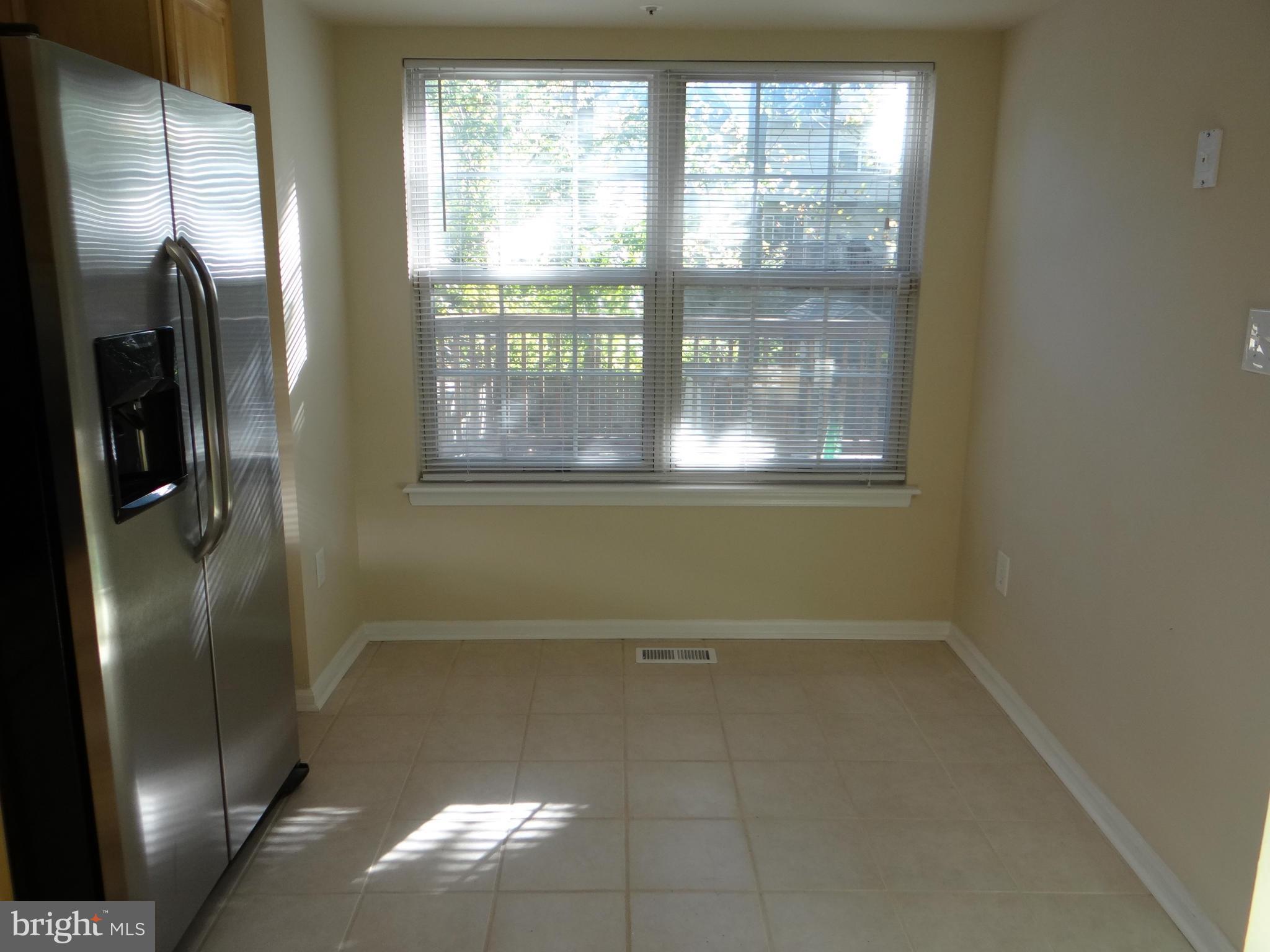 202 Windy Ridge Court Pasadena, MD 21122 - Photo 4 of 28 Kitchen with Table Space