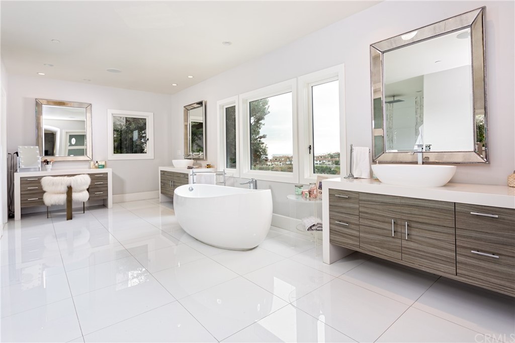 3 Vista Cielo Dana Point, CA 92629 - Photo 12 of 34 a spacious bathroom with double vanity and a bathtub