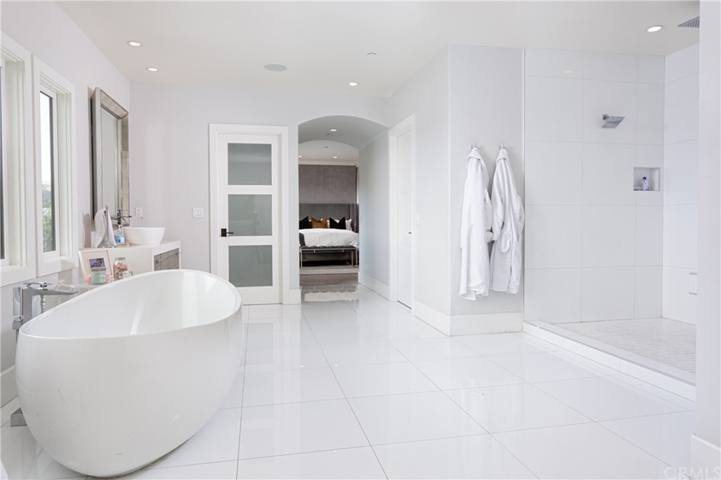 3 Vista Cielo Dana Point, CA 92629 - Photo 13 of 34 a spacious bathroom with a tub sink and mirror