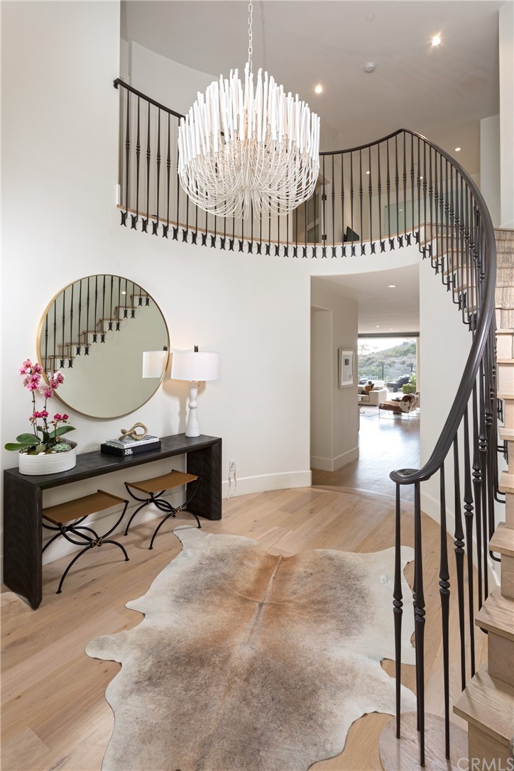 3 Vista Cielo Dana Point, CA 92629 - Photo 3 of 34 a view of a hallway with dining room and chandelier