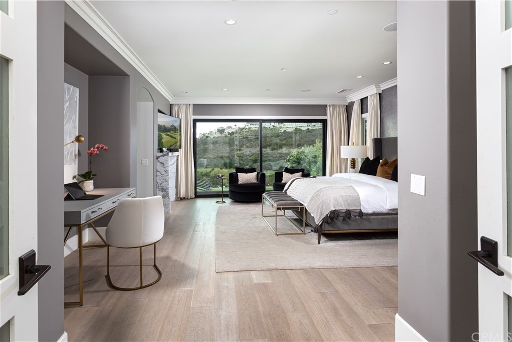 3 Vista Cielo Dana Point, CA 92629 - Photo 8 of 34 a bedroom with a bed and large windows