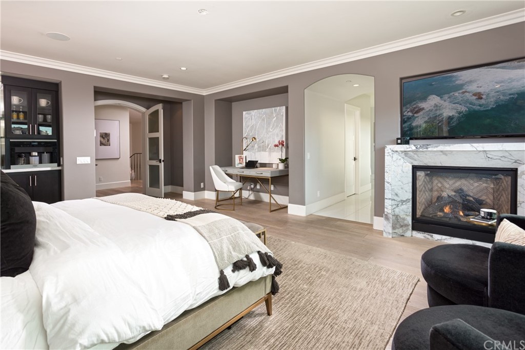 3 Vista Cielo Dana Point, CA 92629 - Photo 9 of 34 a spacious bedroom with a bed and glass window